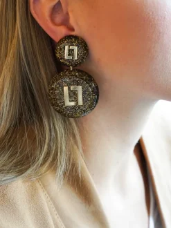 Gouden Glitter Oorbellen Larissa Logo